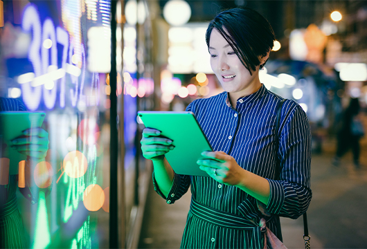 Woman Outside on Tablet