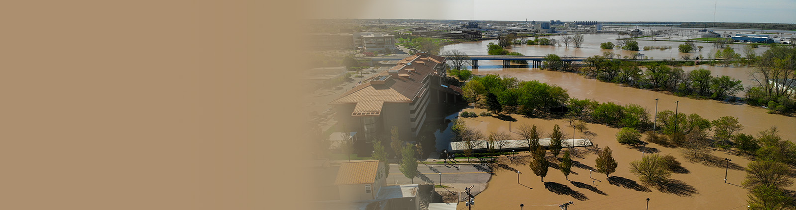 Muddy River Floods Buildings & Trees