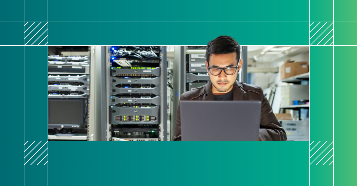 An image of an engineer on a laptop in a data center