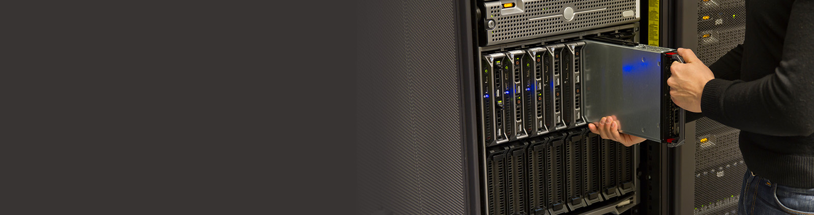 Close-Up Engineer Inserting Part into Server