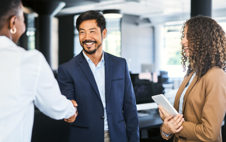 An image of a man and woman shaking hands